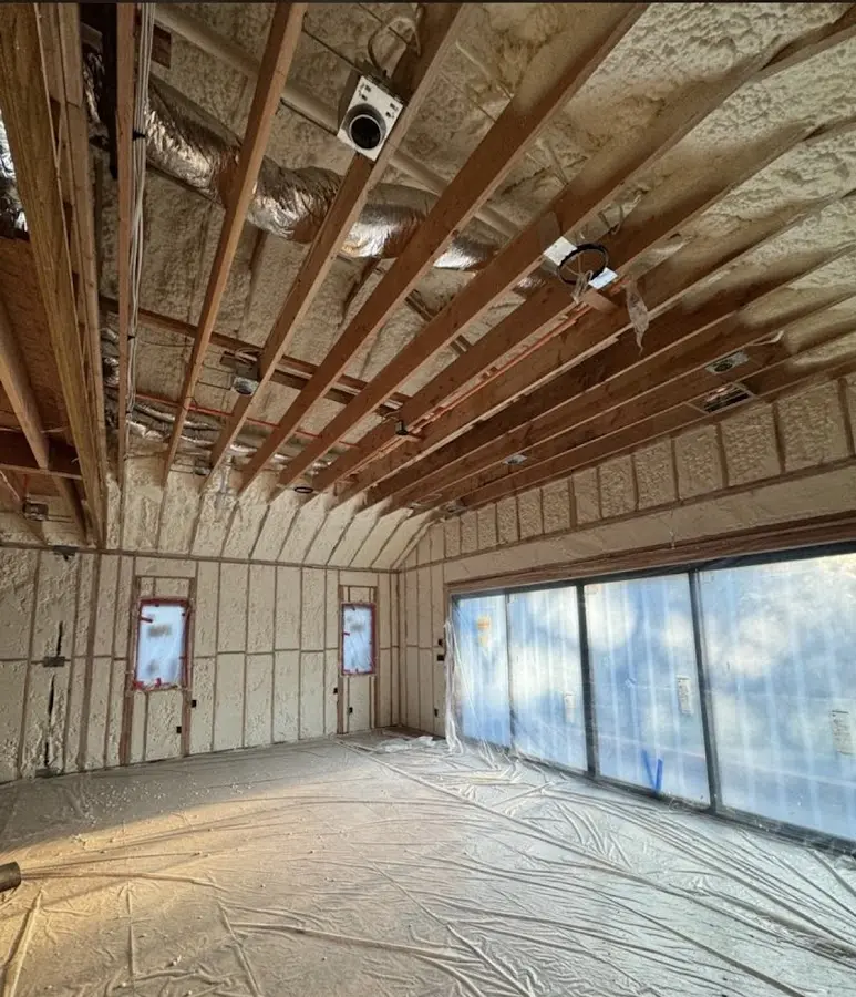 Interior walls and ceiling insulated with spray foam during new construction in Menomonee Falls
